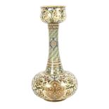 A Middle Eastern cream ground long neck vase, with allover floral gilded decoration, partial back