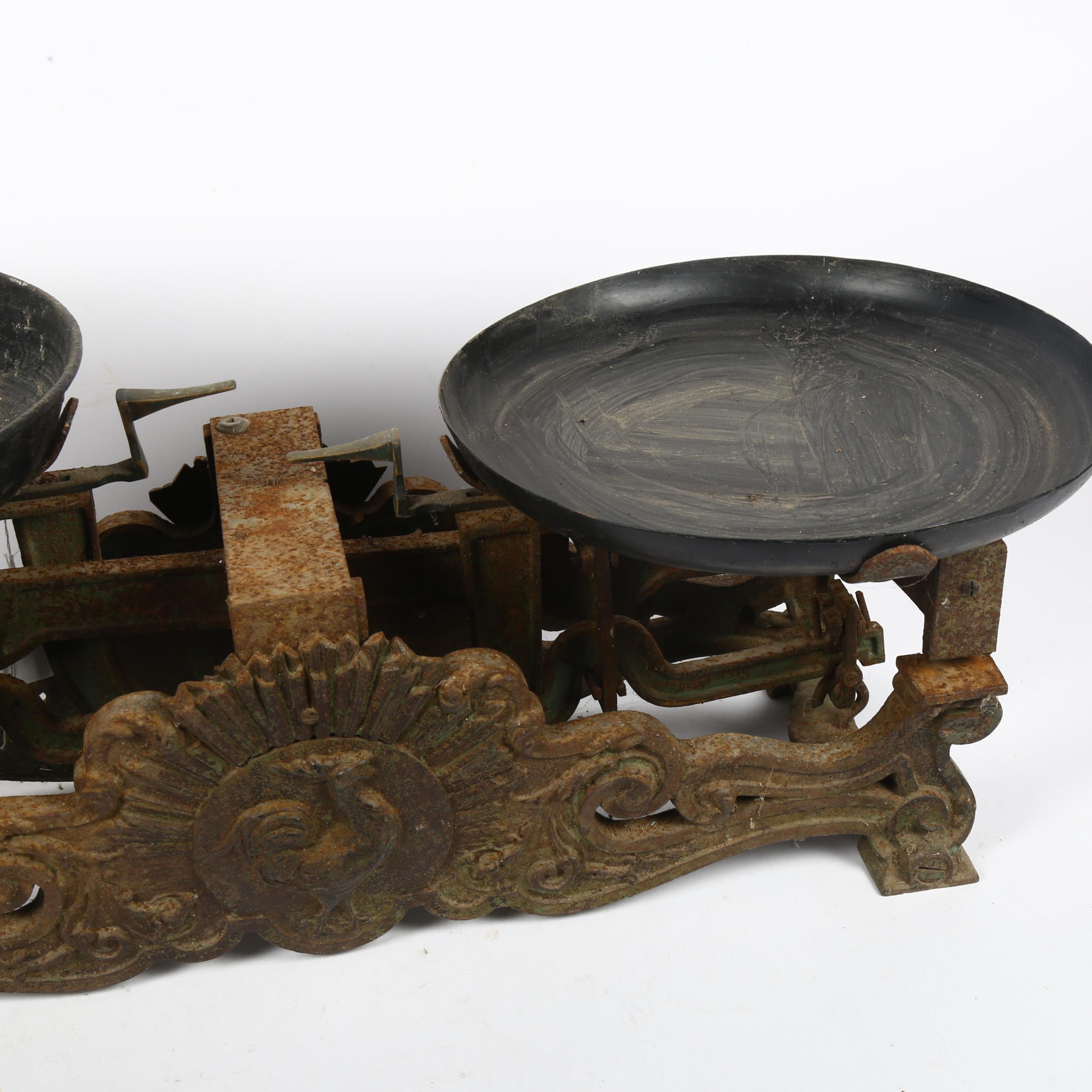 An Antique set of cast-iron balance scales, with relief cockerel motif, width 62cm - Image 2 of 2