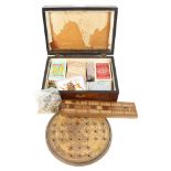 A box with playing cards, cribbage board, solitaire game etc