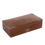 A 1920s rectangular oak cigarette box, with silver mounts, length 23cm