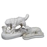 A Parian Ware dog group "Retribution", length 27cm, and a Parian Ware Spaniel