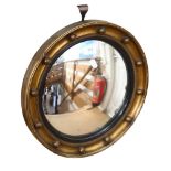 A Vintage convex circular gilt-framed mirror, with ball decoration, 39cm