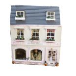 A doll's house, in the style of a pink bridal shop, 3 floors with fitted interior, H30cm, L51cm,