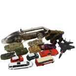 A table cannon, model tanks, and cars