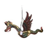 A wooden and hand painted hanging dragon, length 60cm