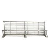 A polished steel Vintage luggage rack from a train, with wall fittings, length 117cm