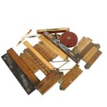 A quantity of Vintage measuring instruments, tape measures, rulers and levels