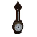 Aneroid barometer with thermometer, in carved oak surround, height 89cm