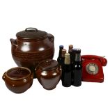 1960s red dial telephone, stoneware storage jars, and souvenir ales