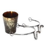 A small horn beaker with engraved fox hunting scene, and a pair of Antique steel spurs