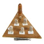 A group of 6 silver thimbles, a turned treen thimble holder and thimble, and an engraved silver