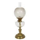 A Victorian brass Eltex oil lamp with glass font, complete with etched glass shade and funnel,