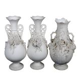 A pair of Parian Ware vases, 32cm, and another with applied grapevine decoration