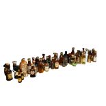 A large quantity of alcoholic miniatures, including Scotch, Guinness, Vodka, Whisky etc, novelty