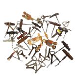 A collection of Vintage corkscrews and bottle stoppers, including some German Black Forest stoppers