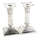 A pair of Colonial Corinthian column silver candlesticks, height 14.5cm, marked Silver S.B