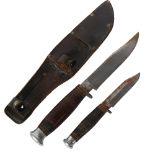 A graduated pair of Vintage drop point knives, in original fitted leather scabbard
