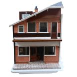 A modern doll's house with 2 furnished floors, H 82cm, L63cm, W62cm