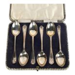 A set of 6 silver coffee spoons, with golfing motif handles
