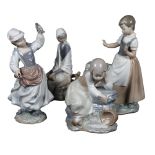 2 Lladro figures, girl with bird, and a seated girl, and 2 NAO figures, girl with pitcher, 28.5cm,