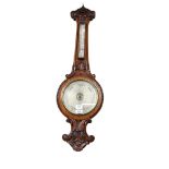 BALOM & COMPANY LONDON AND EDINBURGH - a Victorian carved oak-framed aneroid barometer, length 95cm