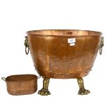 A Victorian copper and brass coal bucket or log bin, with brass lion-head ring handles, and brass