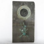 A slate-backed wall mirror with sconce, height 56cm