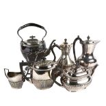 A group of silver plated half fluted tea and coffee pots, spirit kettle on stand etc