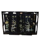 A set of 4 Oriental wall plaques with applied design, height 91cm