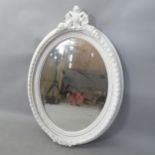 A large bevel-edge oval wall mirror, in white painted frame, height 112cm