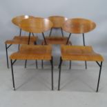 A set of 4 1950s bent teak ply chairs, with iron rod frames and brass capped feet, in the manner