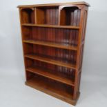 An Antique Arts and Crafts oak open bookcase, having 4 fixed shelves and panelled sides, 103cm x