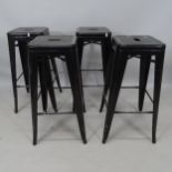 A set of 4 painted metal industrial stacking stools, H77cm