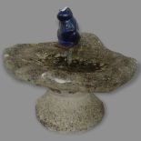 A weathered concrete garden ornament, in the form of a frog in lily pad, 45 x 45 x 40cm