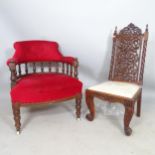 A modern mahogany and upholstered hall chair, with allover carved decoration, and an early 20th