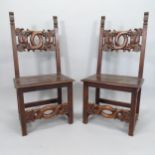 A pair of 19th century Italian Renaissance Revival oak hall chairs, with auricular carved back and
