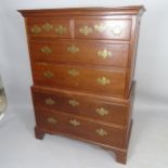 An Antique mahogany 2-section chest of chest, having 2 short and 4 long drawers, on bracket feet,