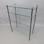 A mid-century 4-tier shelving unit, having 4 glass shelves and metal frame, 75cm x 91cm x 38cm