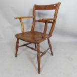 An Antique elm-seated elbow chair