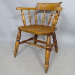 An elm-seated smoker's bow-arm chair