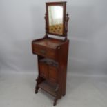 An early 20th century mahogany shaving stand, with raised mirrored top, single fitted drawer and