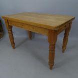 An Antique polished pine farmhouse kitchen table, with end frieze drawer, on turned legs, 122 x 79 x