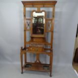 An Antique Arts and Crafts oak mirror-back hall stand, 88 x 202 x 35cm