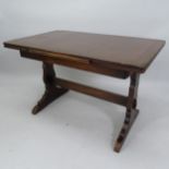 An oak draw leaf dining table, 114cm extending to 174cm x 74cm x 72cm