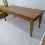 An Antique fruitwood farmhouse dining table with single-end drawer, on square tapered legs, 193cm