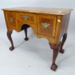 An Antique crossbanded walnut lowboy, with 3 fitted drawers, on mahogany cabriole legs...