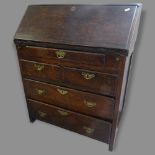 A stained oak bureau, the fall-front having a fitted interior, with 5 drawers below, 78 x 96 x