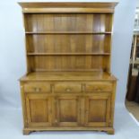 A mid-century oak 2-section dresser, having 3 fitted drawers and cupboards under, with label for