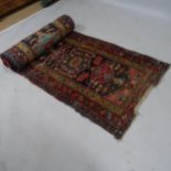 A red ground Afghan runner with multiple pattern border, 346 x 86cm Runner is heavily worn
