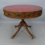 A mahogany circular drum table, with red embossed leather skiver, and 4 frieze drawers, 92 x 77cm